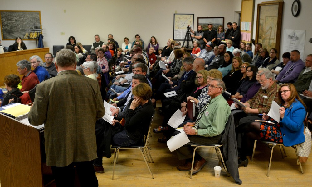 Eric Haley, left, superintendent of schools discusses the school budget Tuesday with community members and city councilors during a meeting at The Center in downtown Waterville.