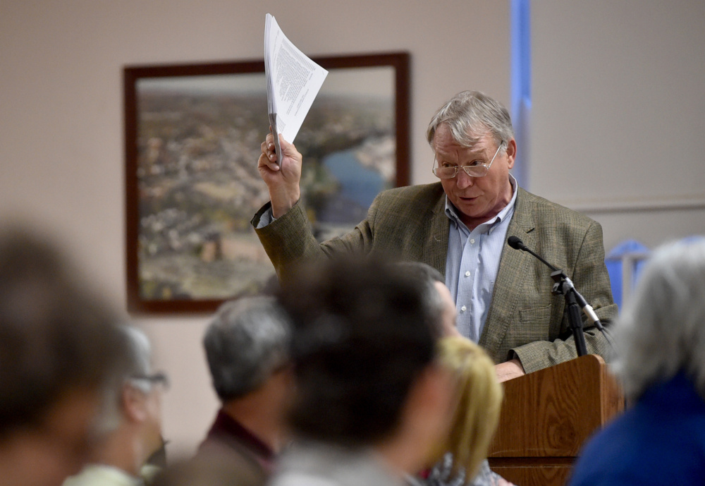 Eric Haley, superintendent of schools discusses the school budget Tuesday with community members and city councilors during a meeting at The Center in downtown Waterville.