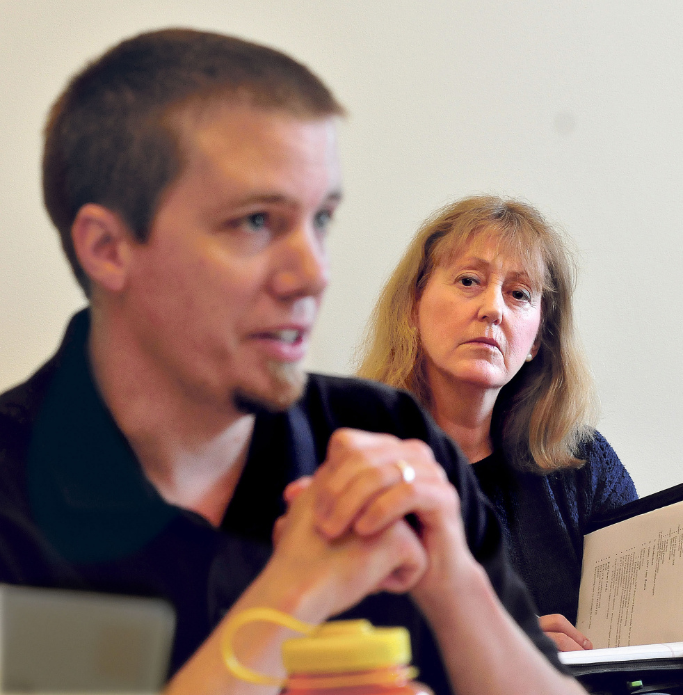 Lisa Smith, director of the Humane Society Waterville Area, listens as Garth Russell, representing animal control officers statewide, agreed Thursday with others at the meeting of the Animal Welfare Advisory Council that owners need to be held accountable for their dogs' actions.