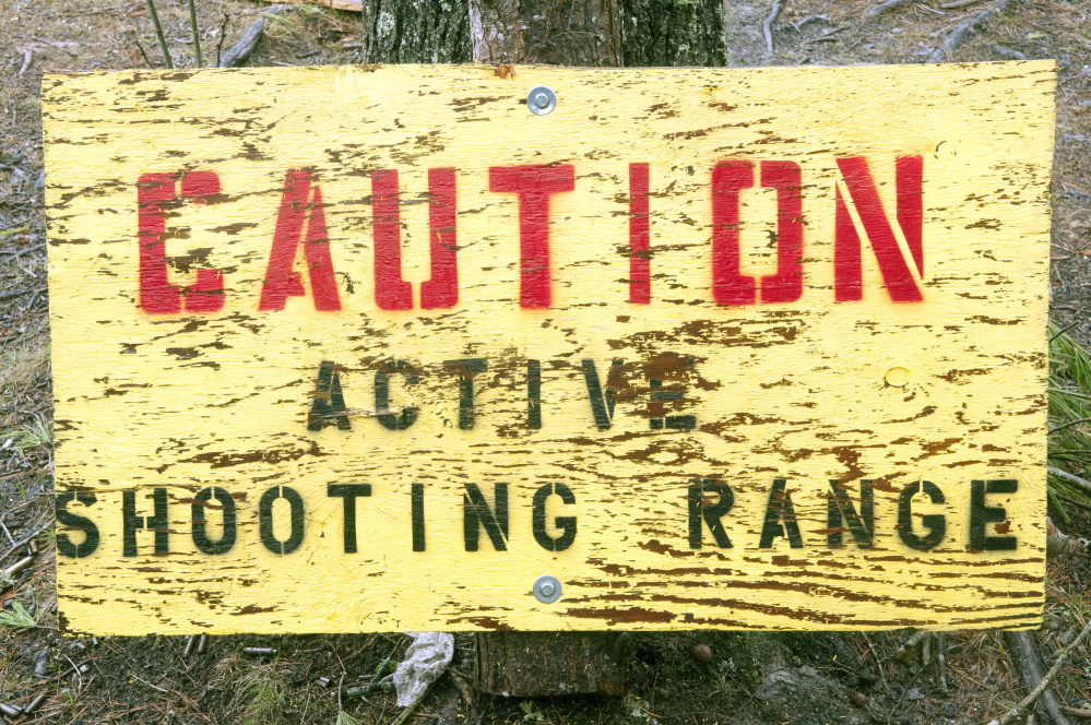 Staff photo by Joe Phelan
A warning sign is seen Thursday at the West Gardiner Rod & Gun Club gun range behind the clubhouse.