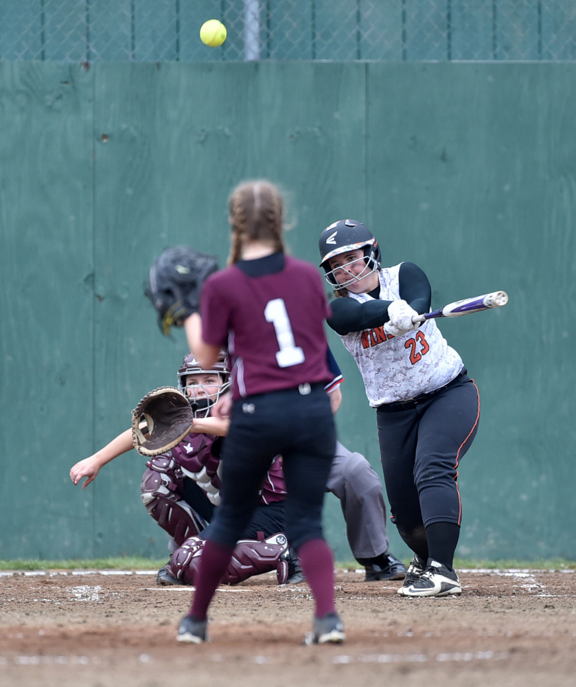 Winslow's Bailey Robbins (23) makes contact on a pitch from Nokomis' Brittany Bubar (1) on Thursday in Winslow.