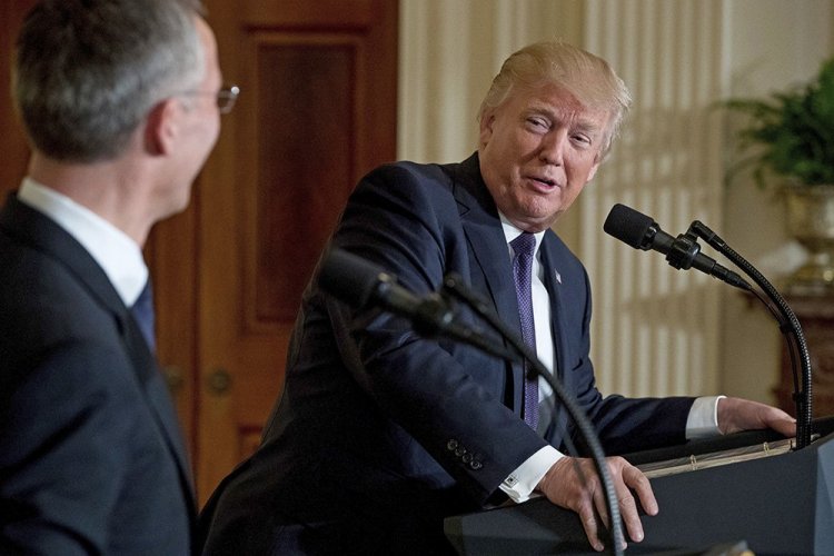 President Trump, accompanied by NATO Secretary General Jens Stoltenberg, speaks at a news conference at the White House Wednesday. 