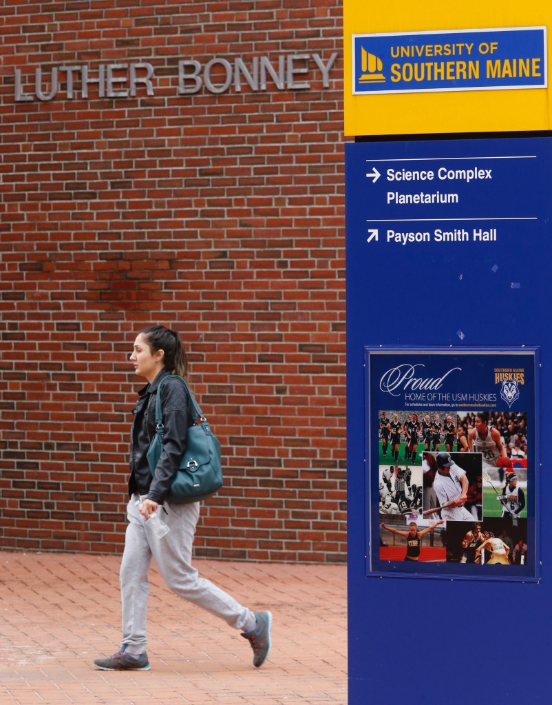 Farkhunda Jamal, a USM junior who lives in Westbrook, said she was disheartened but not surprised by an anti-Muslim message on a poster hung in the school's Luther Bonney Hall (background). Jamal, a Muslim who immigrated to the U.S. from Afghanistan when she was 6, said she believes this latest on-campus message of intolerance indicates what some people in the community are thinking, but aren't outwardly expressing.
