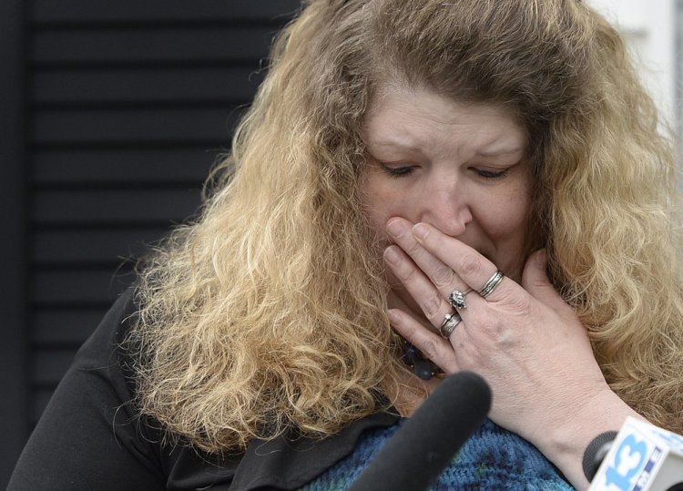 Sandra Scribner Merlim, of Naples, is emotional as she speaks about the impending deportation of her husband, Otto Morales-Caballeros, on Wednesday.