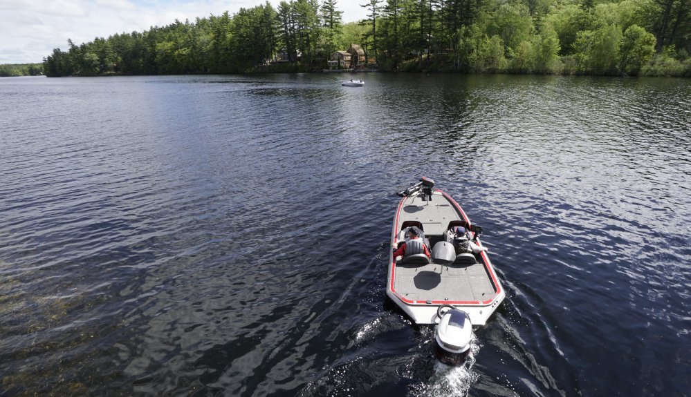Saturday's improving weather made for a nice day on Mousam Lake for Chris Lloyd, right, and his father, Don Lloyd.