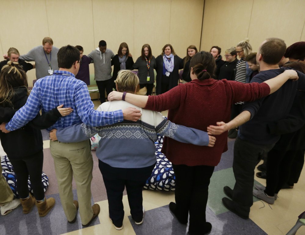 Students and teachers gather at Hope Academy in Indianapolis in support of students returning to school after treatment for addiction. The opioid epidemic has raged for years since the medical community bought into questionable research showing unrealistically low addiction rates for pain pills, such as hydrocodone.
