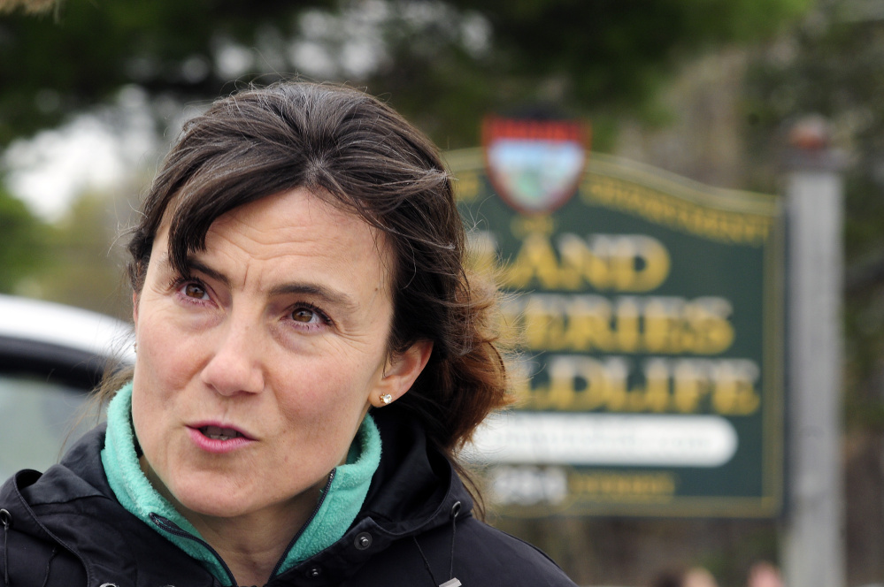 Staff photo by Joe Phelan
Kristina Snyder, of Chester, New Hampshire, was the spokesperson for about a dozen protesters Friday at the Maine Department of Inland Fisheries & Wildlife headquarters in Augusta, demanding that the department investigate DEW Haven in Mount Vernon.