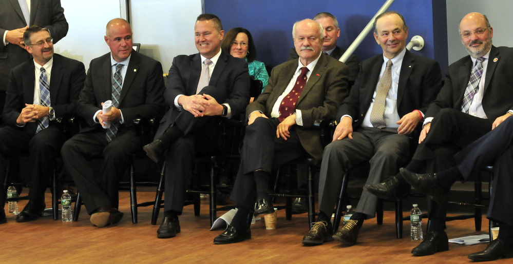 Thomas College and area business officials listen Wednesday at the college as Greg Powell, chairman of the Alfond Foundation, announces that the college would receive $5.3 million for the new Harold Alfond Institute of Business Innovation. From left are Mike Duguay, Rick Bryant, Chris Guance, David Flanagan, Bill Alfond and Conrad Ayotte.