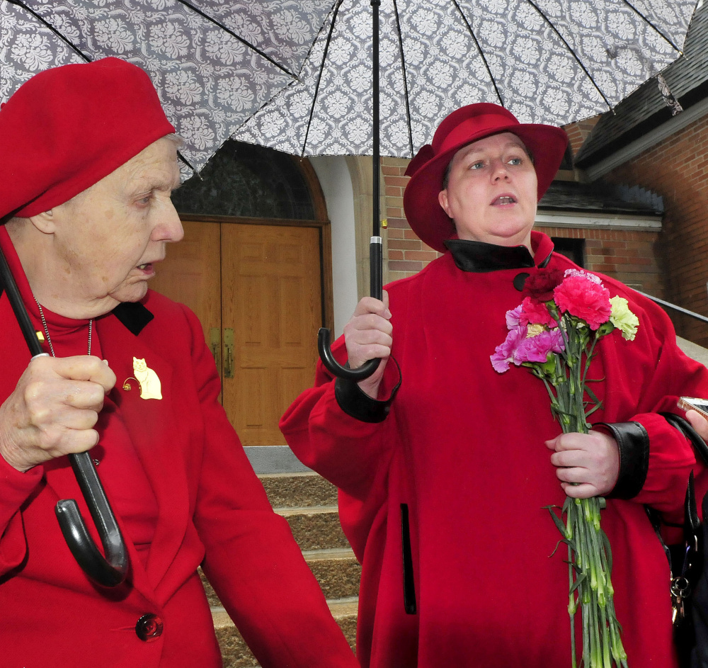 Margaret May Lambert, right, and her mother Mary Theresa Huebner, outside the St. Joseph Maronite Catholic Church Sunday in Waterville following a Mass, discuss the recent removal of Rev. Larry Jenson over allegations of sexual exploitation of a minor 15 years ago.