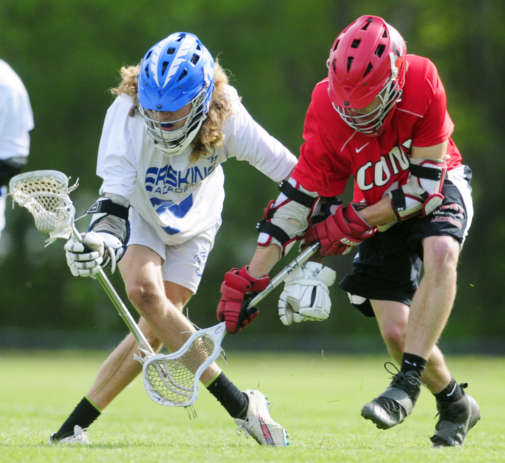 Erskine's Grayson Petty, left, tries to get around Cony's Jason Barnes during a game Tuesday in South China.