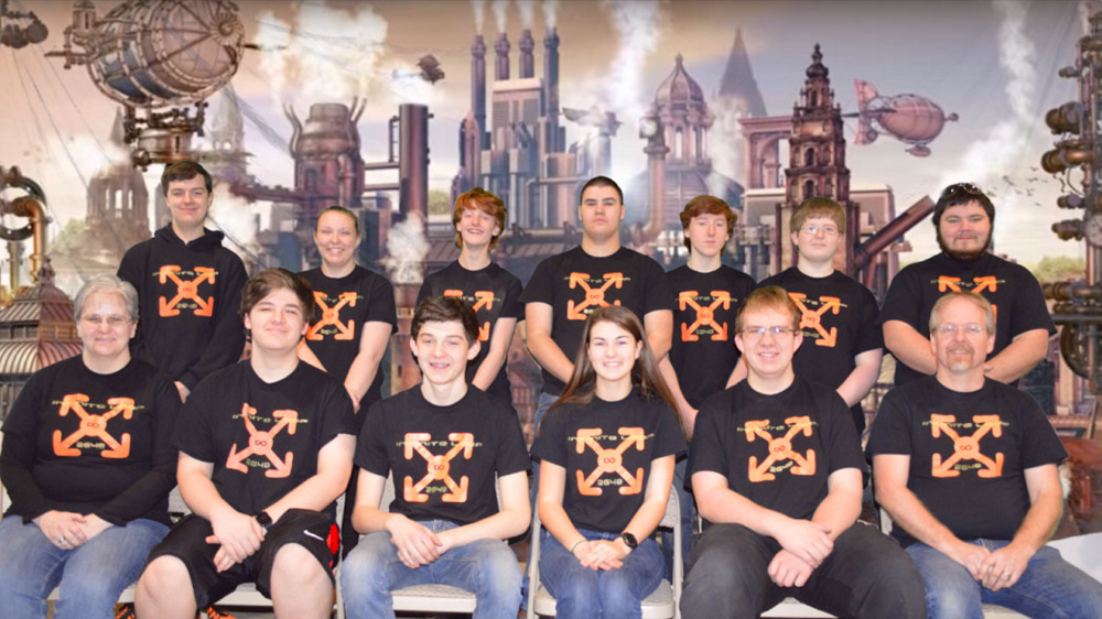 The Infinite Loop team for this school year poses for a photo. In the front row, from left, are Coach Lisa Klein, Michael Viens, Vann Guarnieri, Chelsea Perry, Ethan Pullen and Coach Keith McGlauflin. In the back row, from left, are mentor Brandon Belanger, Victoria Christianson, Kody King, Delsin Klein, David Hreben, Kai McGlauflin and mentor Justin Shuman. T.J. Petrill is not pictured.