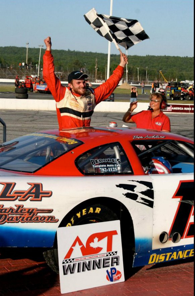 Ben Ashline celebrates winning an American-Canadian Tour race at Oxford Plains Speedway in 2012.