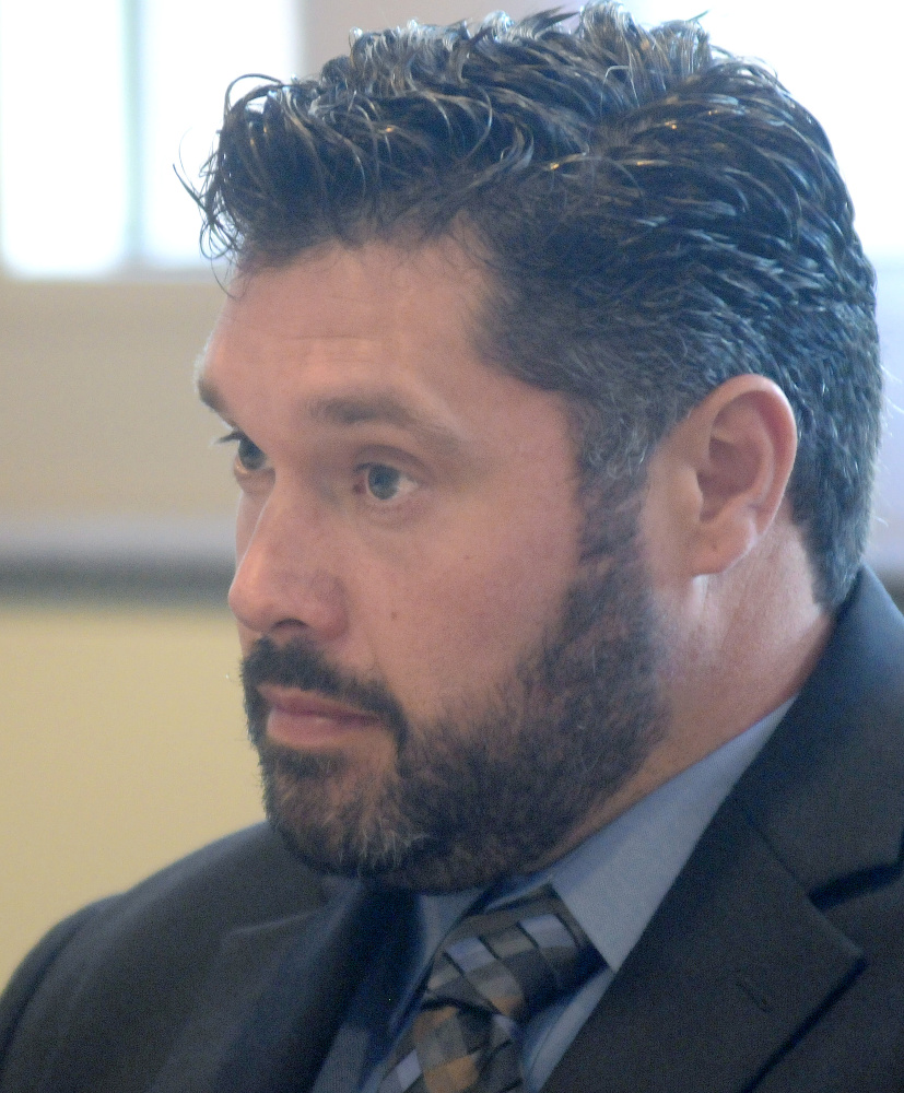 Bryan Carrier answers questions from Bureau of Motor Vehicles hearing officer Ben Tucker during a hearing in Augusta Sept. 26, 2016, to get his license back.