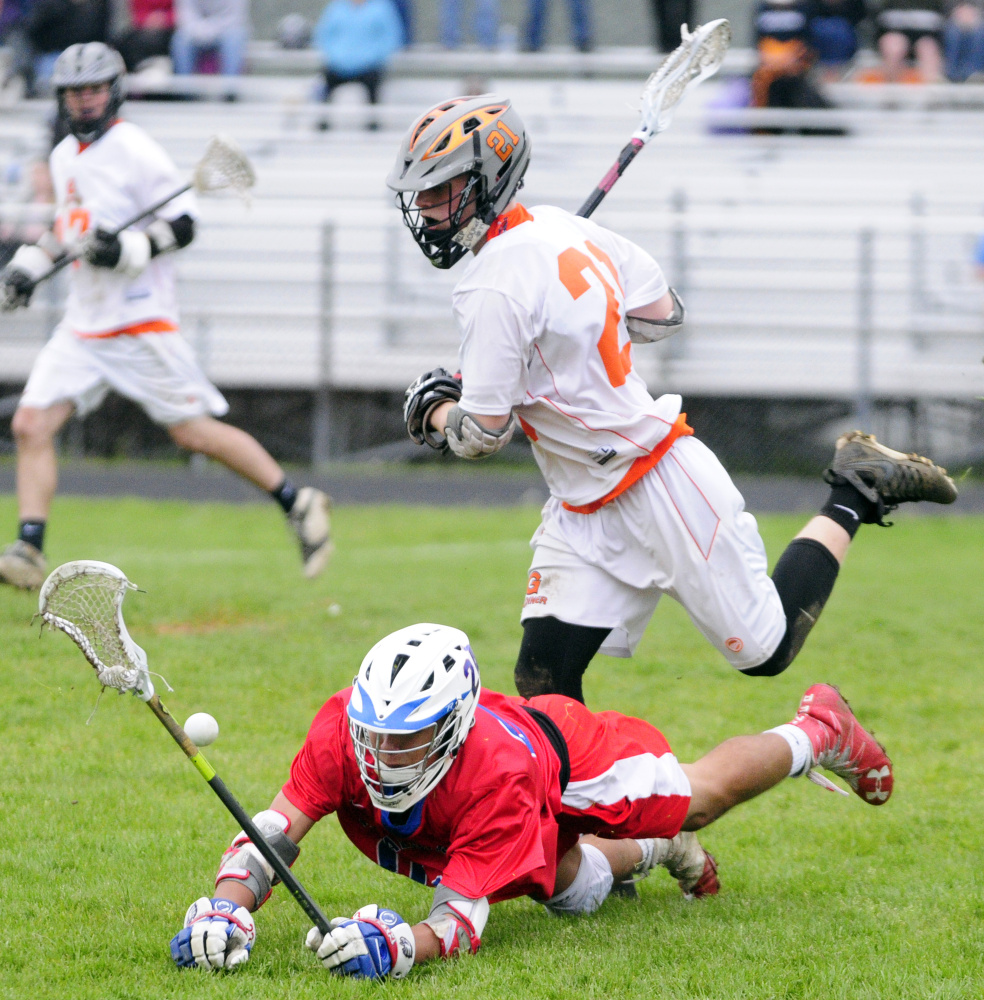 Messalonskee's Dan Gusmanov, left, and Gardiner's Sloan Berthiaume collide during game Tuesday at Hoch Field in Gardiner.