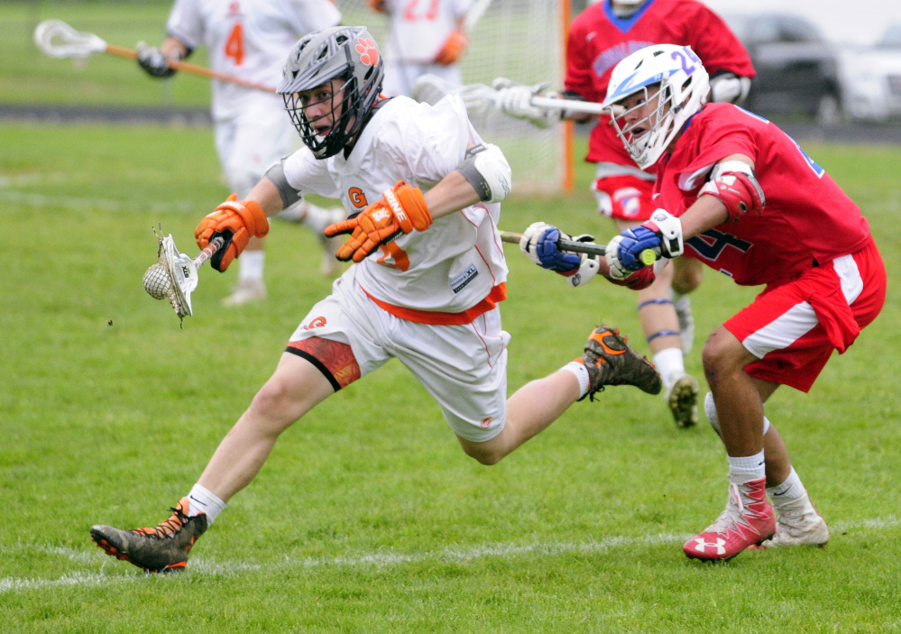 Gardiner's Warren Karlberg tries to get past Messalonskee defender Dan Gusmanov during a game Tuesday at Hoch Field in Gardiner.