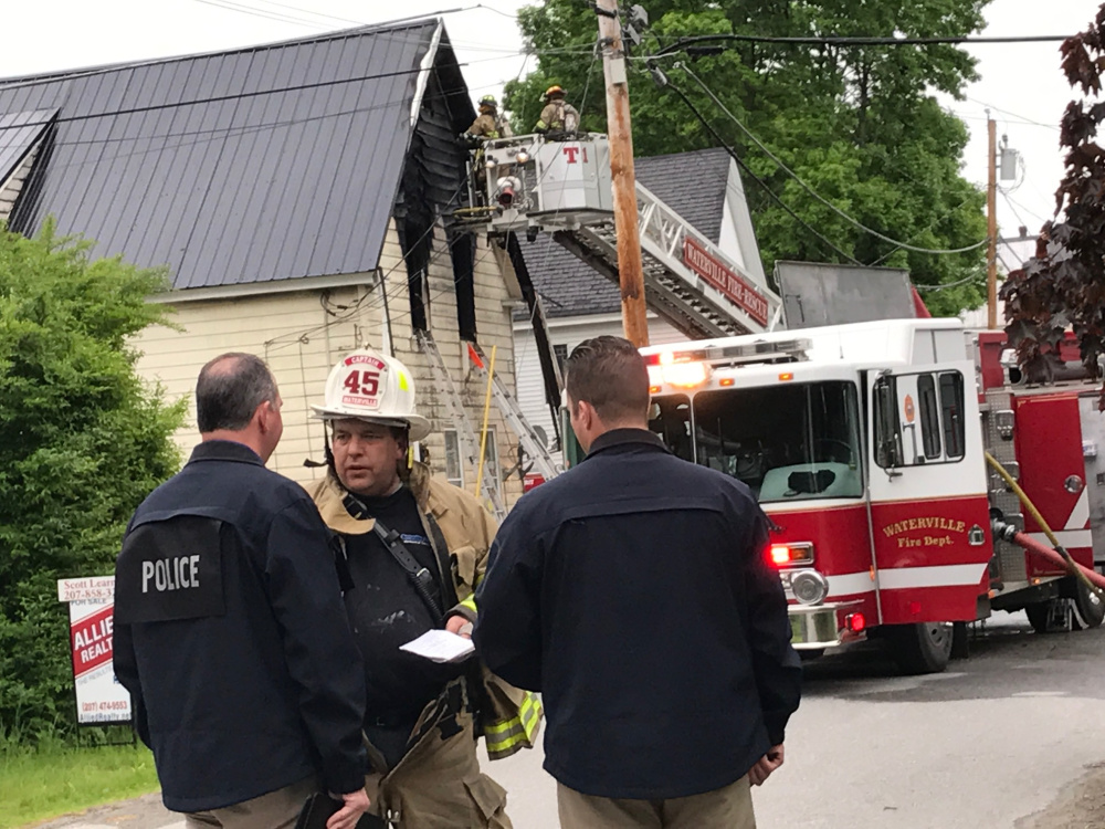 Firefighters at a scene in Waterville.