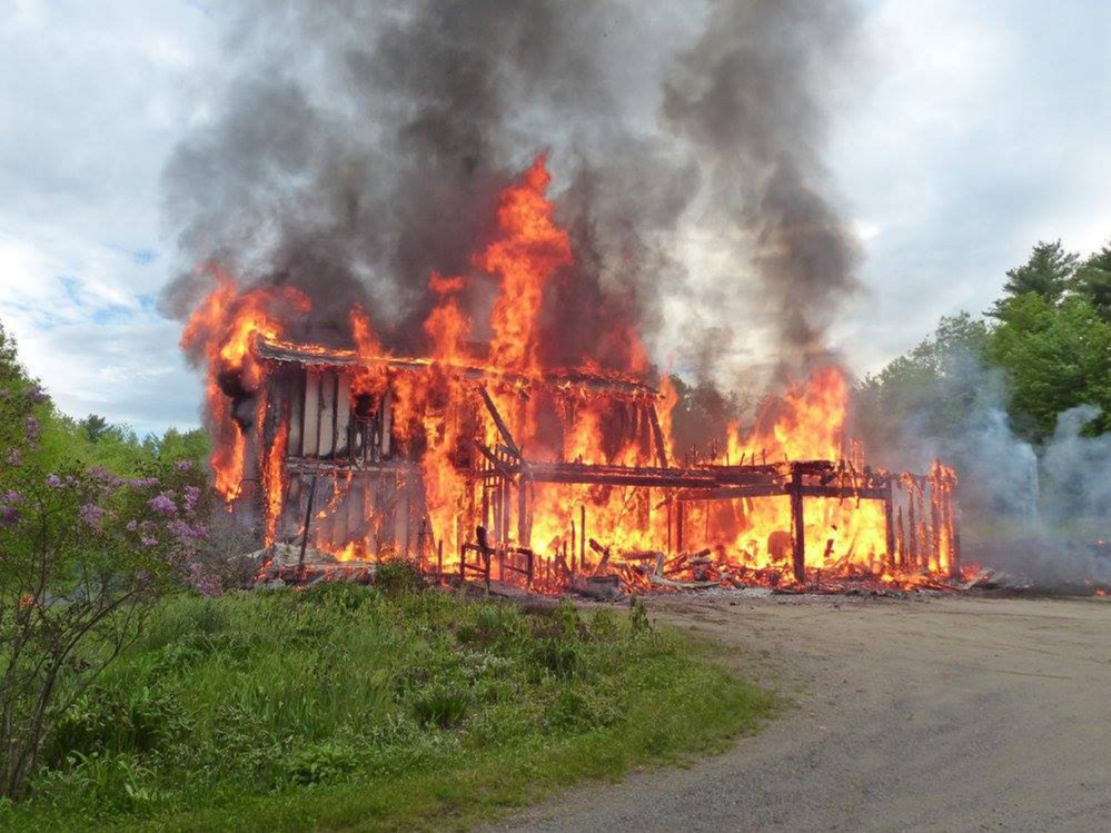 Flames engulf the Davis family home Friday night on North Wayne Road in Wayne. Assistant Fire Chief Jim Welch said no one was injured in the blaze, which destroyed the house and the attached garage.