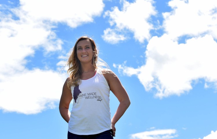 Devon Frechette poses for a portrait Friday at Frechette's Ski-Doo in Wilton. Frechette is the founder of Maine Made Wellness, a health coaching group, and has had great success promoting the group on Facebook.