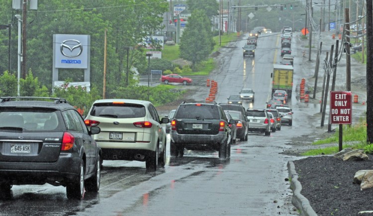This photo taken on July 16, 2014 shows eastbound Western Avenue traffic near the intersection of Woodside Street in Augusta, where Karen Nightingale, 53, hit a large pothole, crashed her motorcycle, and died of her injuries nine days later.