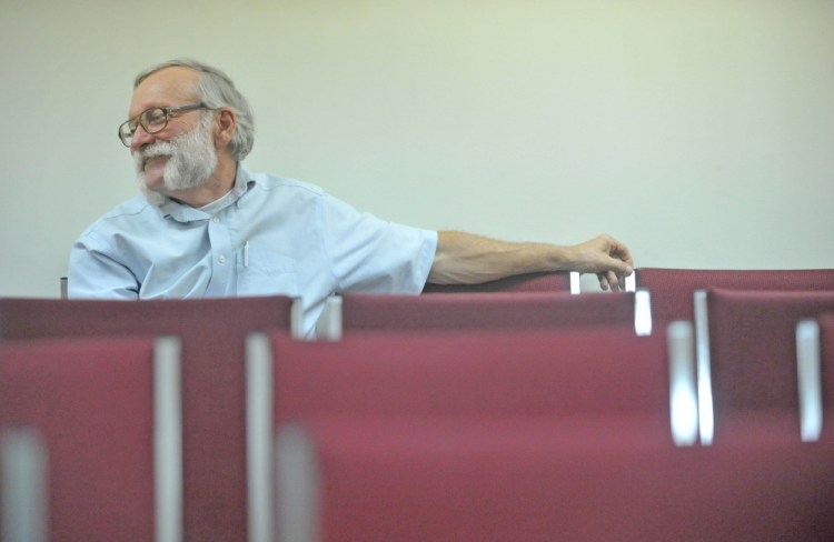 Peter Nielsen, shown in 2014 when he was Oakland's town manager, talks with council members during a meeting at the Oakland Town Office.