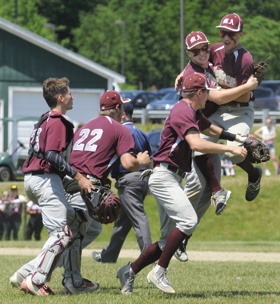 Staff photo by Joe Phelan 
 Members of the Monmouth baseball team celebrate after beating Winthrop in a Class C South semifinal Saturday afternoon in Winthrop.