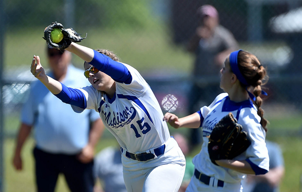 Madison's Marah Hall (15) makes a tough catch during a Class C South semifinal Saturday afternoon against Lisbon in Madison.