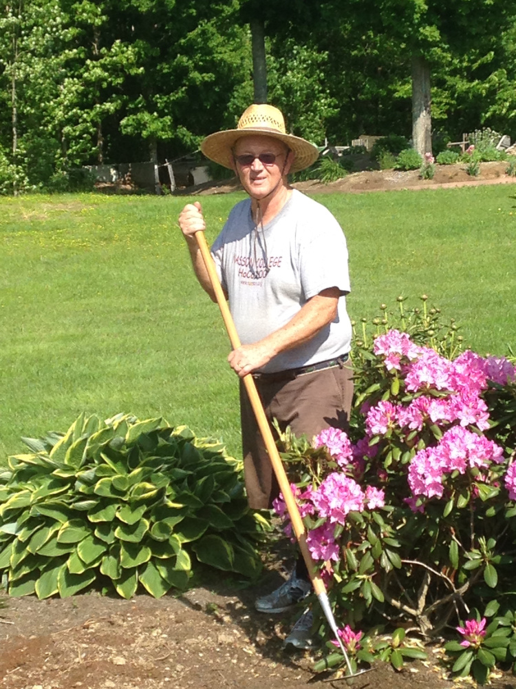 Norm Davis prepares for the West Gardiner Gardeners Garden Tour and Plant Sale. Davis' philosophy is, "If you want to plant something in a place you like, plant it!" His flower gardens are a mix of perennial and annual favorites within six or more areas, along with a lush vegetable garden. Four more gardens on the tour offer unique features, such as a Hosta song garden, gnomes galore garden, a White Fringetree and ponds with turtles and frogs.