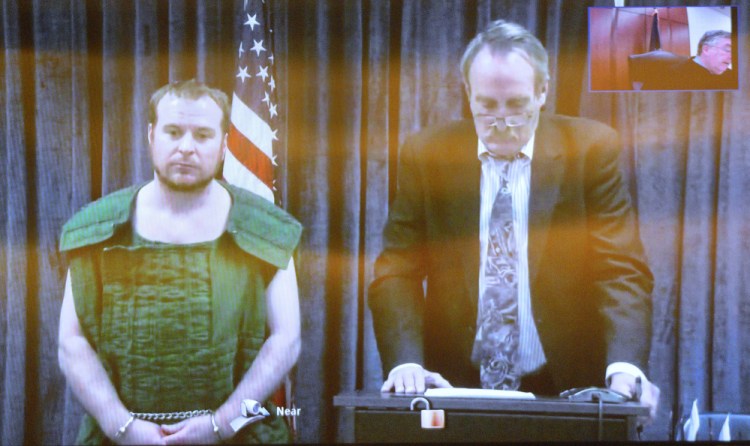 Jeremy Clement, left, and his attorney, Steve Bourget, appear on video from the Kennebec County jail during his initial appearance April 21 in the Capital Judicial Center in Augusta.