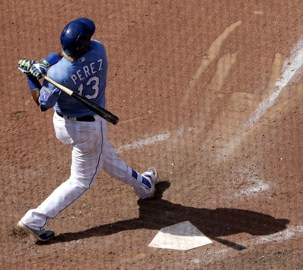 Kansas City Royals catcher Salvador Perez watches his grand slam against the Red Sox during the eighth inning Wednesday in Kansas City. The Royals won 6-4.
