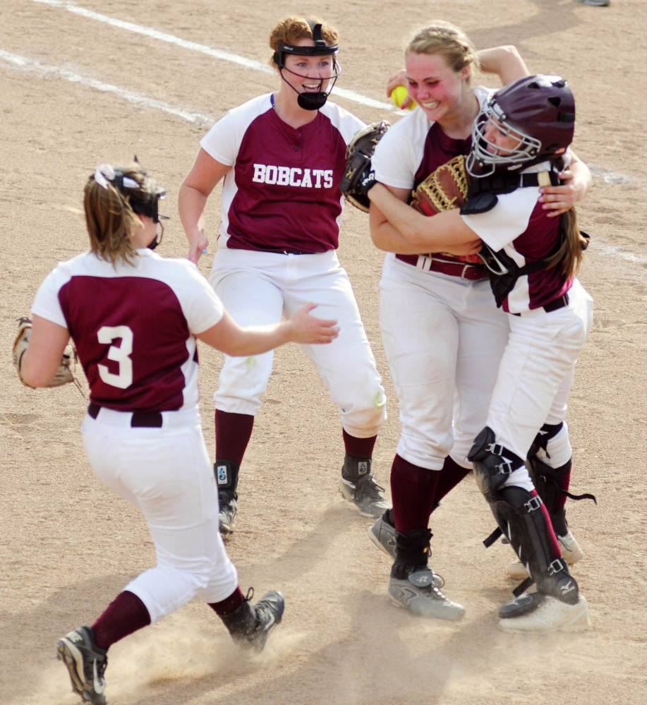 Staff photo by Joe Phelan
Richmond players Camryn Hurley, left, Cassidy Harriman, Sidney Tilton and Meranda Martin celebrate after Richmond beat Greenville in the Class D South championship Tuesday at St. Joseph's College in Standish.