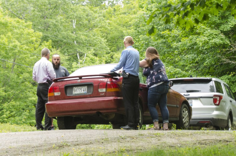 Detectives investigate a shooting death on Yeaton Drive in West Gardiner in this file photo.