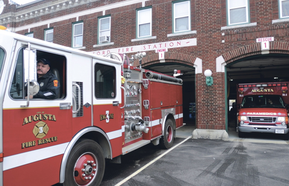 An Augusta firefighter backs a truck into the Hartford Fire Station in this file photo.