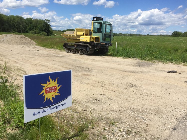 Portland-based ReVision Energy has begun to build a 2,944-panel solar array on South Portland's capped landfill. 