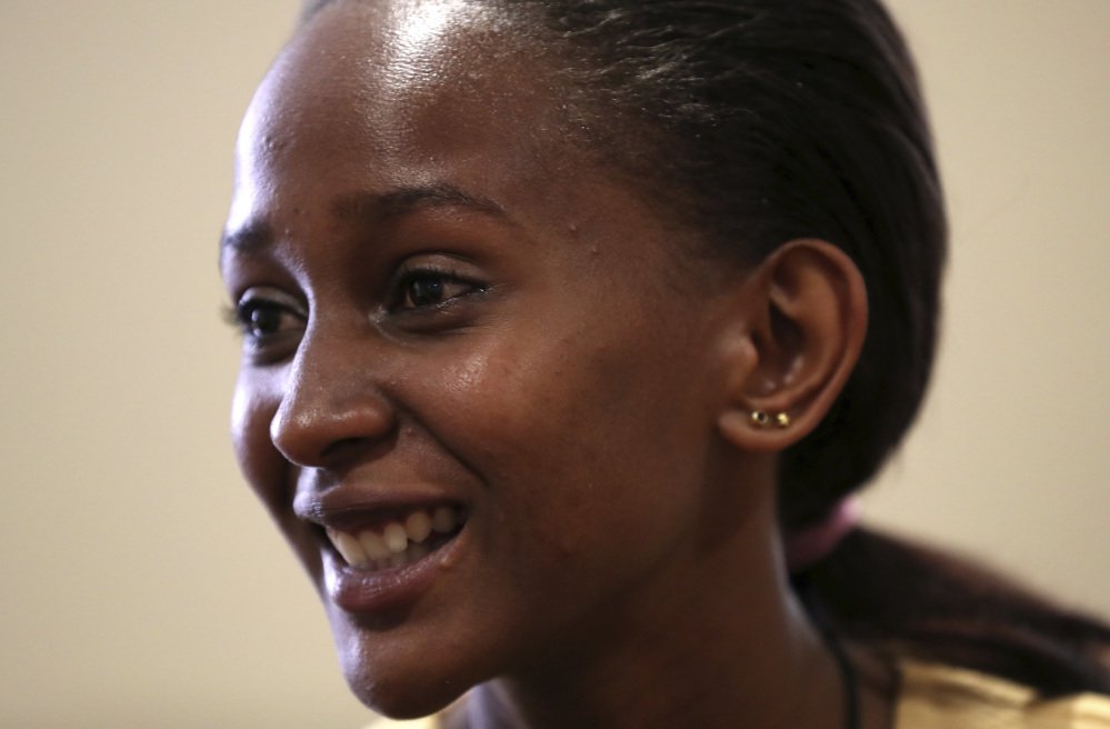 In this Wednesday, July 26, 2017, photo, Diana Macharia, 19, of Sri Lanka, talks about meeting fellow victims of terror at Project Common Bond, a summer camp being held at Colby College in Waterville, Maine. Macharia is among a group of dozens of international teenagers and young adults brought together by a shared history of suffering due to terrorism, violent extremism and war.