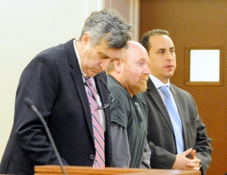 Attorneys Ronald Bourget, left, and Darrick Banda, right, stand with Roland Cummings during sentencing Jan. 21, 2016, at the Capital Judicial Center in Augusta. He was sentenced to life without parole for murder of Aurele Fecteau.