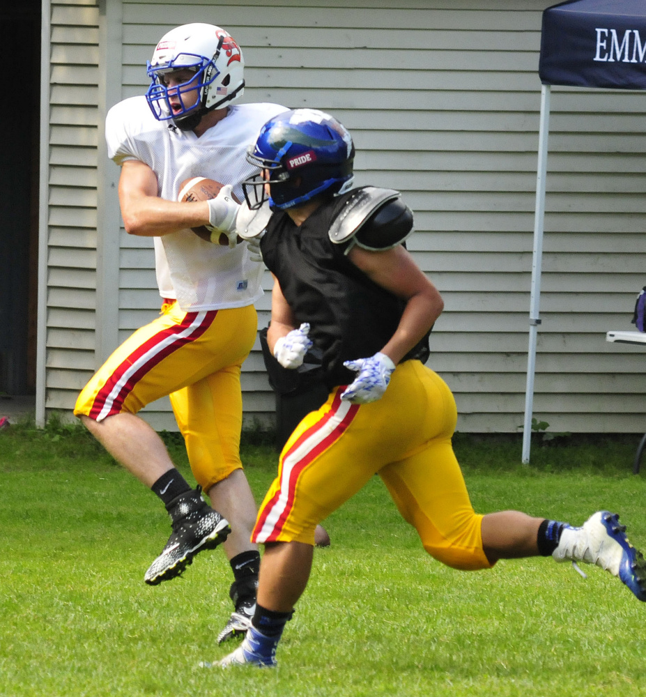 Staff photo by David Leaming
East receiver Mitch Jarvais grabs a throw during Lobster Bowl practice Tuesday at Dover-Foxcroft.