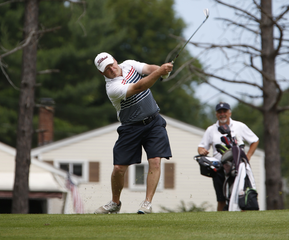 Ricky Jones swings for the green during the final hole of the opening round at the Maine Amateur on Tuesday at Brunswick Golf Club.