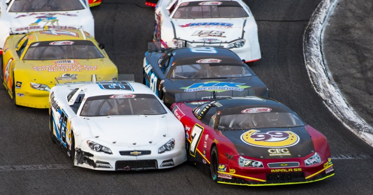 Joey Doiron (73) and Travis Benjamin (7) battle for the early lead during the Oxford 250 last August at Oxford Plains Speedway.