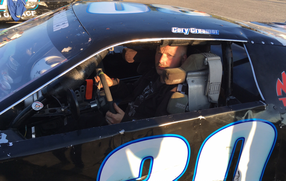 Cory Creamer of Randolph climbs into his car prior to a Super Street division feature race at Wiscasset Speedway last Saturday.