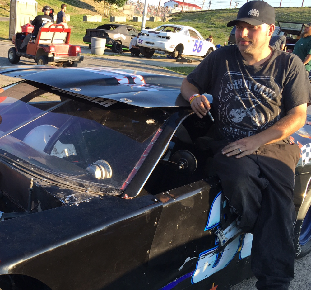 Cory Creamer of Randolph leans against his car during a break in the action last weekend at Wiscasset Speedway. Creamer has done virtually everything there is to do at the track, including now competing on Saturday nights in the Super Street division.