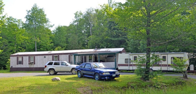 The Russell Road residence of Lori Hayden, Dustin Tuttle and Carroll Tuttle Jr., the day after Tuttle Jr. killed Hayden and their son, Dustin, along with a neighbor, Michael Spaulding.