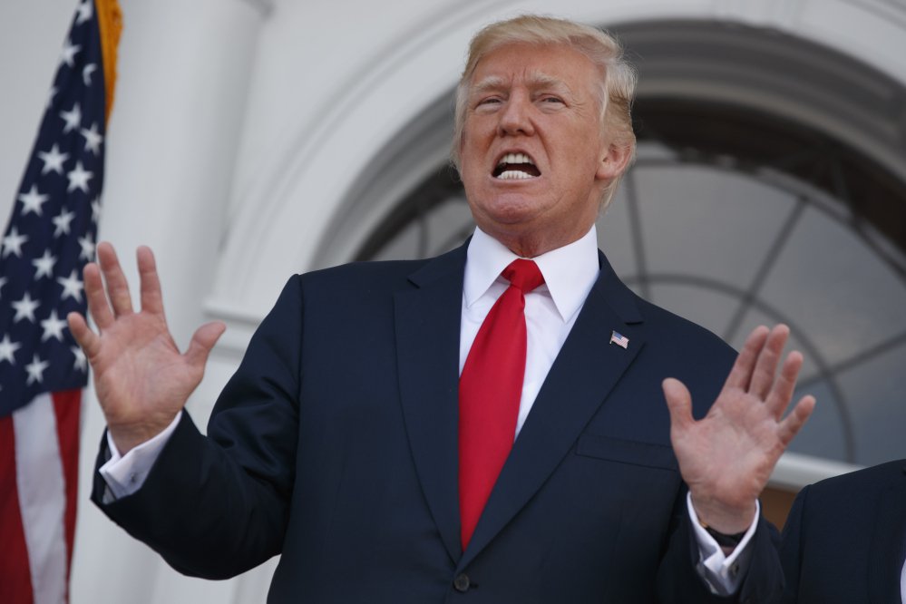 President Trump speaks to reporters before a security briefing at Trump National Golf Club in Bedminster, N.J., Thursday.