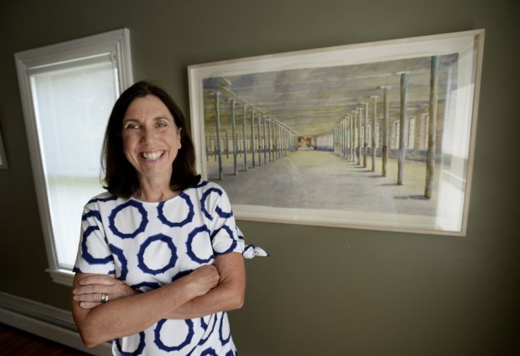Barbara Prey in her studio in  Port Clyde next to studies of her painting that is now hanging at The Massachusetts Museum of Contemporary Art.