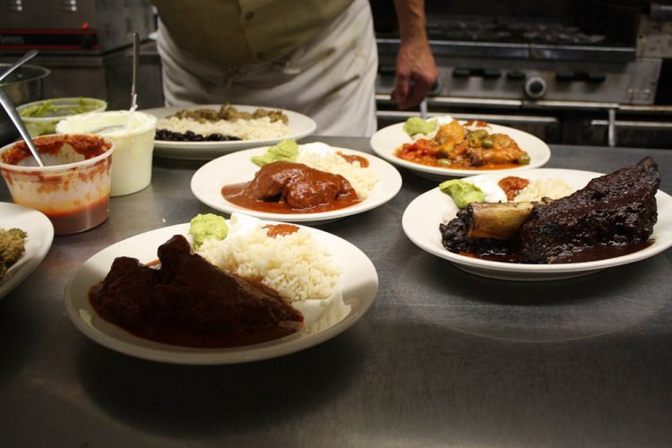 Dishes get some last-minute love before being served.