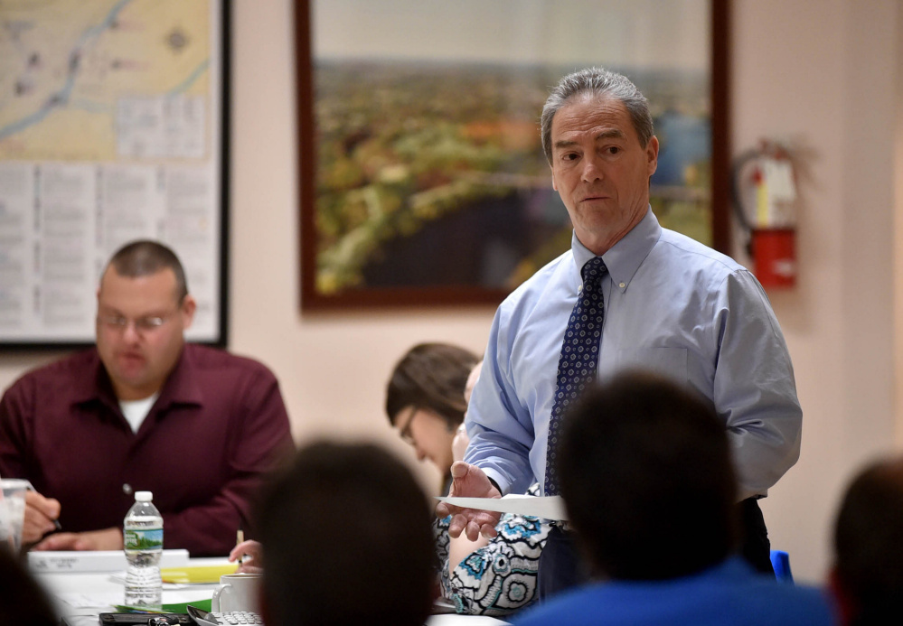 Mike Roy, Waterville city manager, discuss the city's budget during a meeting at the City Chambers in Waterville in this March 28 file photo.