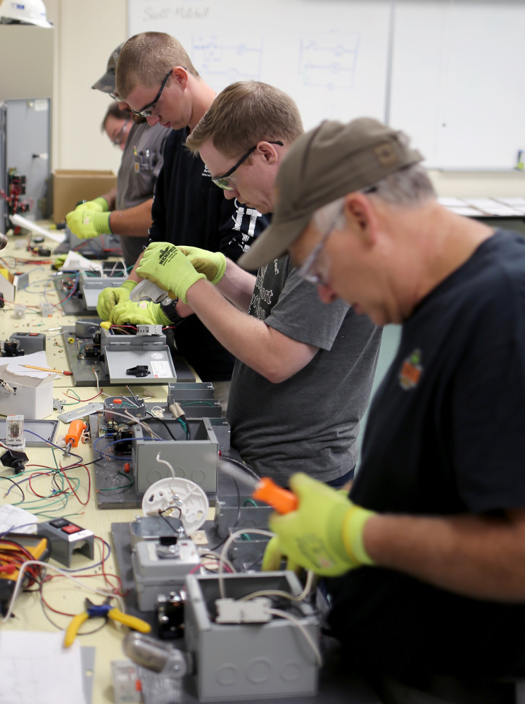 Cianbro employees work in this file photo on August 17, at the company's new workforce development facility in Pittsfield.