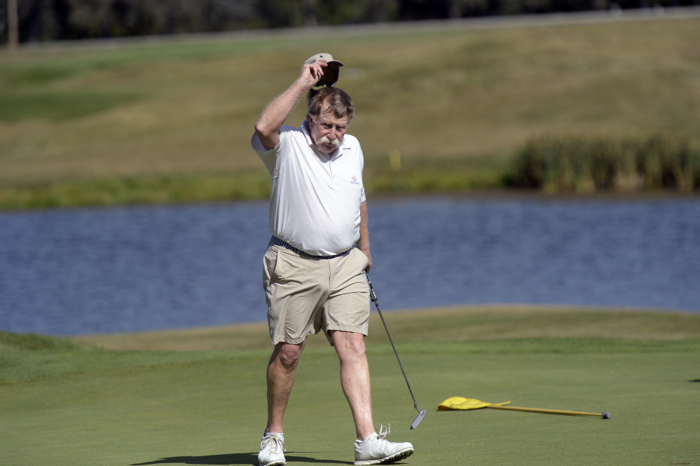 Manchester native Mark Plummer tips his hat after winning the Maine Senior Amateur on Wednesday at the Falmouth Country Club.