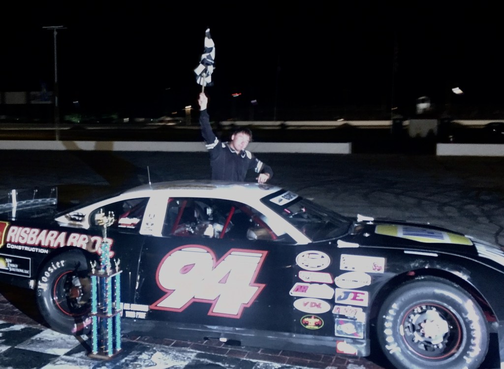 Garrett Hall of Scarborough celebrates his Granite State Pro Stock Series 100 win Saturday night at Oxford Plains Speedway.