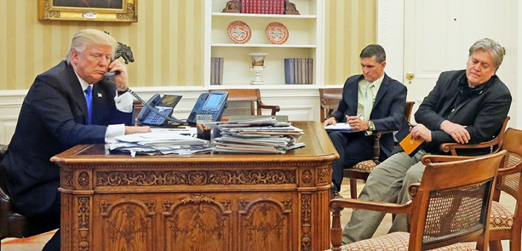 President Trump speaks by phone with Australia's Prime Minister Malcolm Turnbull in the Oval Office on Jan. 28, 2017. Then-national security adviser Michael Flynn and senior adviser Steve Bannon listen in. 