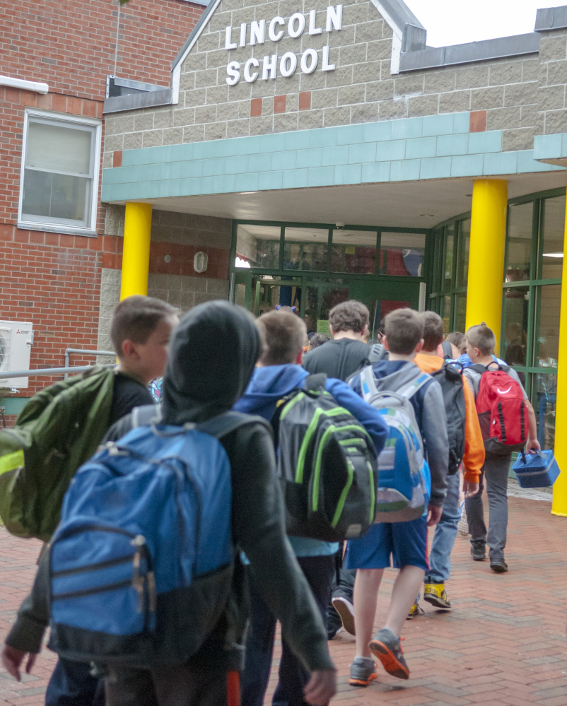 AUGUSTA, ME - AUGUST 30: Students file into Lincoln School for first day of school on Wednesday Aug. 30, 2017 in Augusta. (Staff photo by Joe Phelan/Staff Photographer)